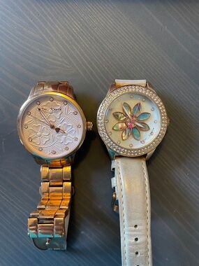 Two Watches:
Rose Gold Floral Embossed Dial Watch,
Floral Crystal Accent Watch